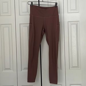 Dark coral leggings with pockets on both sides, worn once in awhile, size M